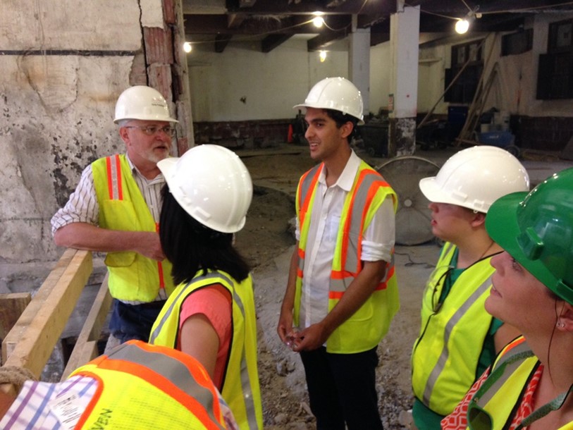 Summer Scholars on a construction education tour of The Cavalier, a local historic restoration project by Hanbury